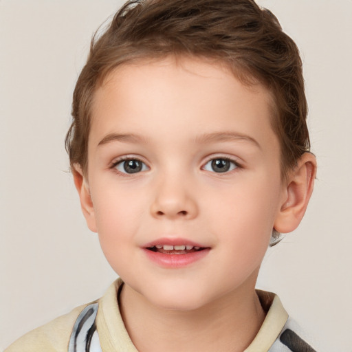 Joyful white child male with short  brown hair and brown eyes