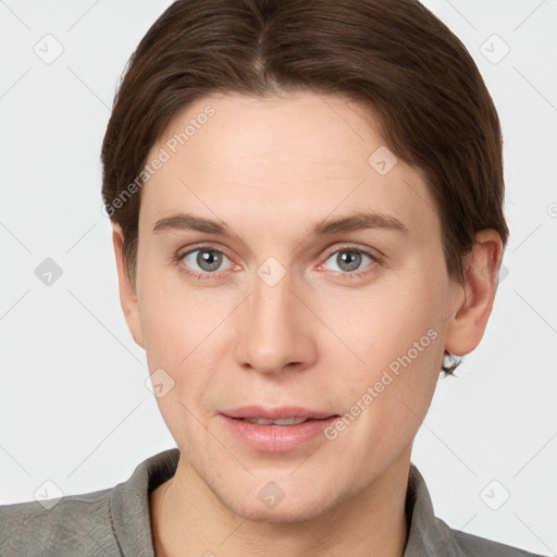 Joyful white young-adult female with short  brown hair and grey eyes