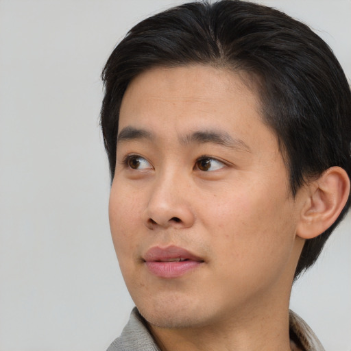Neutral asian young-adult male with short  black hair and brown eyes