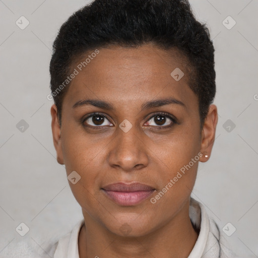 Joyful black young-adult female with short  brown hair and brown eyes