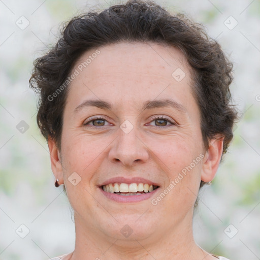 Joyful white adult female with short  brown hair and brown eyes