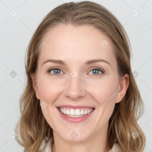 Joyful white young-adult female with medium  brown hair and blue eyes