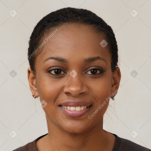 Joyful black young-adult female with short  black hair and brown eyes