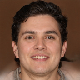 Joyful white young-adult male with medium  brown hair and brown eyes