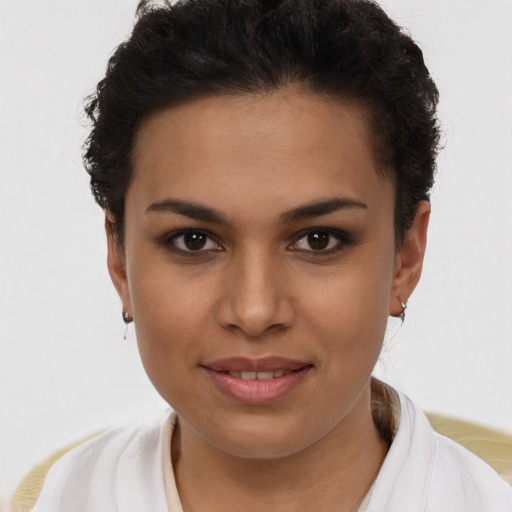 Joyful latino young-adult female with short  brown hair and brown eyes