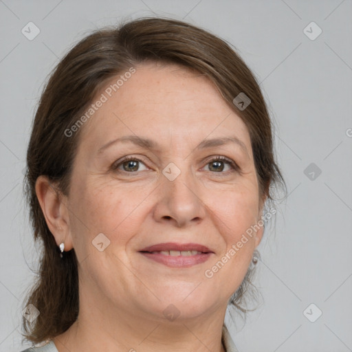 Joyful white adult female with medium  brown hair and grey eyes