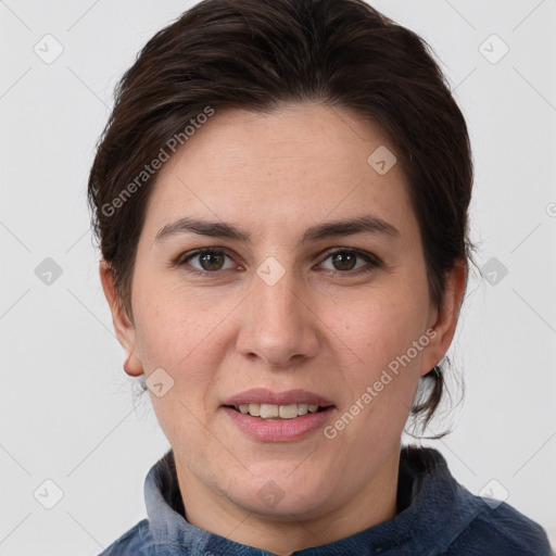 Joyful white adult female with medium  brown hair and brown eyes