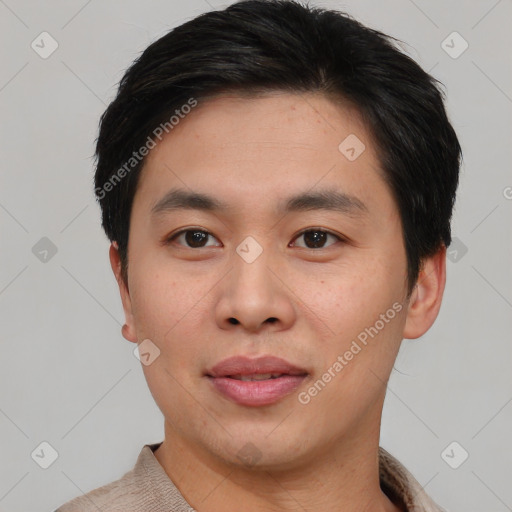 Joyful white young-adult male with short  black hair and brown eyes