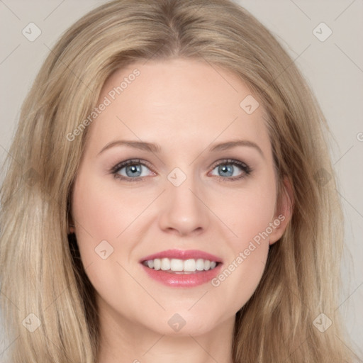 Joyful white young-adult female with long  brown hair and blue eyes