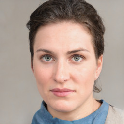 Joyful white young-adult female with medium  brown hair and blue eyes