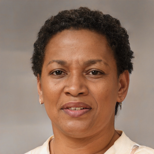 Joyful black adult female with short  brown hair and brown eyes