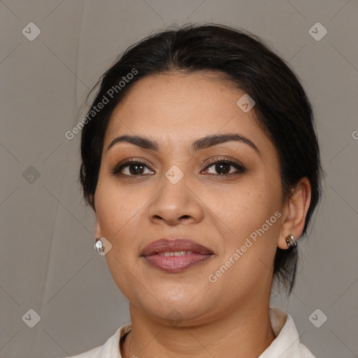 Joyful latino young-adult female with medium  brown hair and brown eyes