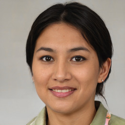 Joyful asian young-adult female with medium  brown hair and brown eyes