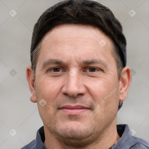 Joyful white adult male with short  brown hair and grey eyes