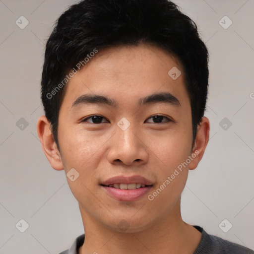 Joyful asian young-adult male with short  black hair and brown eyes