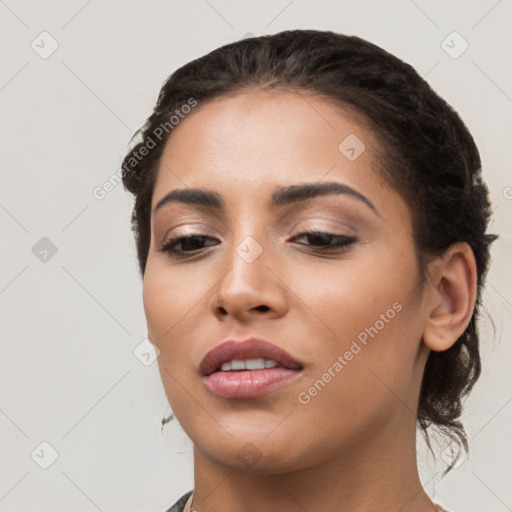 Joyful white young-adult female with long  black hair and brown eyes