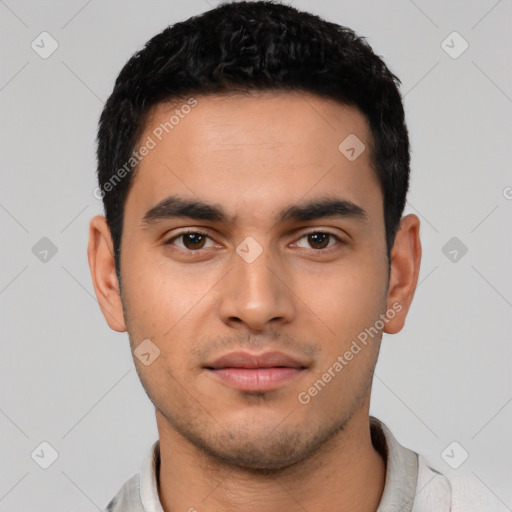 Neutral latino young-adult male with short  black hair and brown eyes