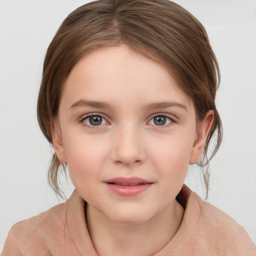 Joyful white child female with medium  brown hair and grey eyes