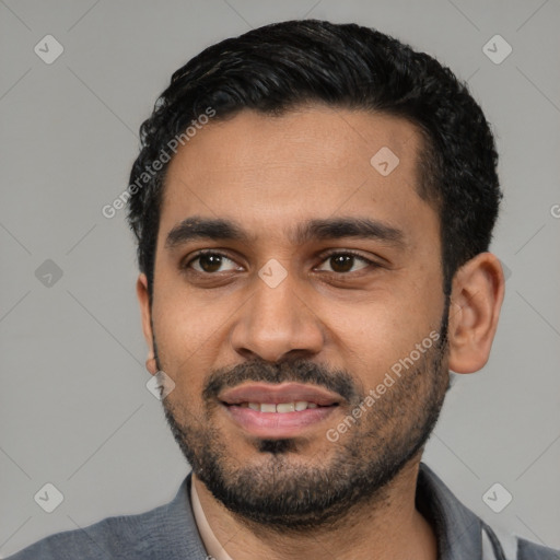 Joyful latino young-adult male with short  black hair and brown eyes