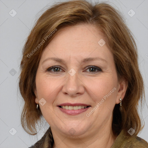 Joyful white adult female with medium  brown hair and brown eyes