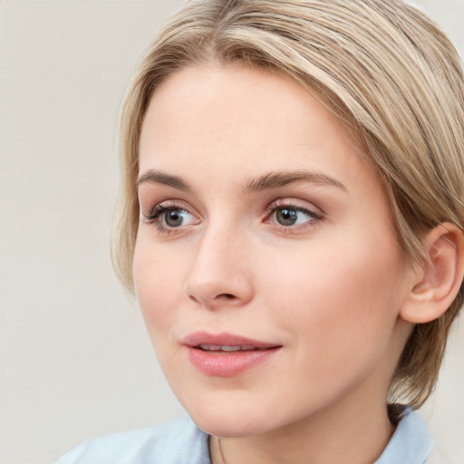 Joyful white young-adult female with medium  brown hair and blue eyes