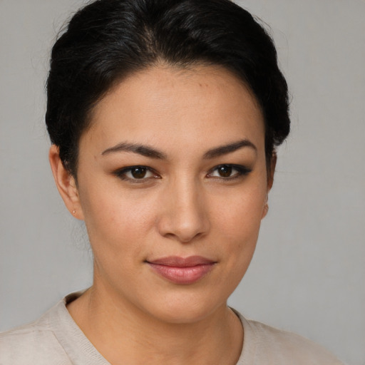 Joyful asian young-adult female with short  brown hair and brown eyes