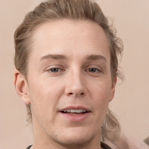 Joyful white adult male with short  brown hair and grey eyes