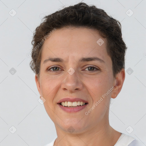 Joyful white adult female with short  brown hair and brown eyes