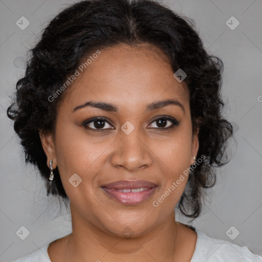 Joyful black adult female with medium  brown hair and brown eyes