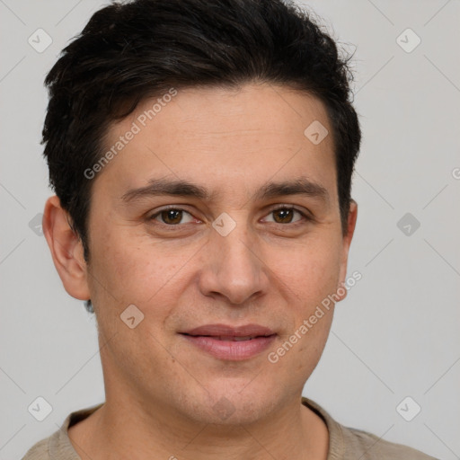 Joyful white adult male with short  brown hair and brown eyes