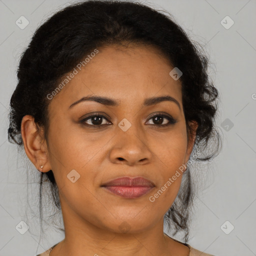 Joyful black adult female with medium  brown hair and brown eyes