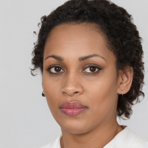 Neutral black young-adult female with short  brown hair and brown eyes