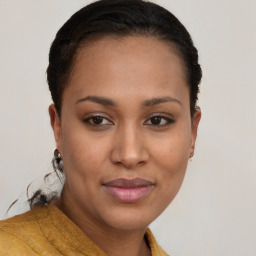 Joyful black young-adult female with short  brown hair and brown eyes