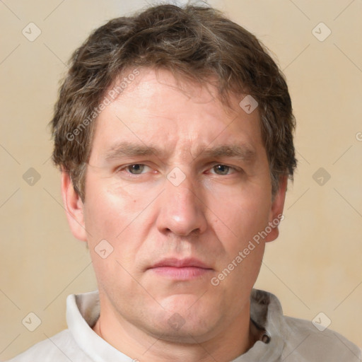 Neutral white adult male with short  brown hair and grey eyes