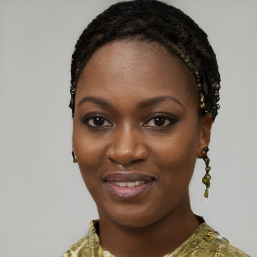 Joyful black young-adult female with short  black hair and brown eyes