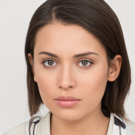 Neutral white young-adult female with medium  brown hair and brown eyes