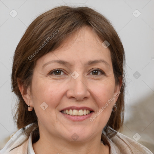 Joyful white adult female with medium  brown hair and brown eyes