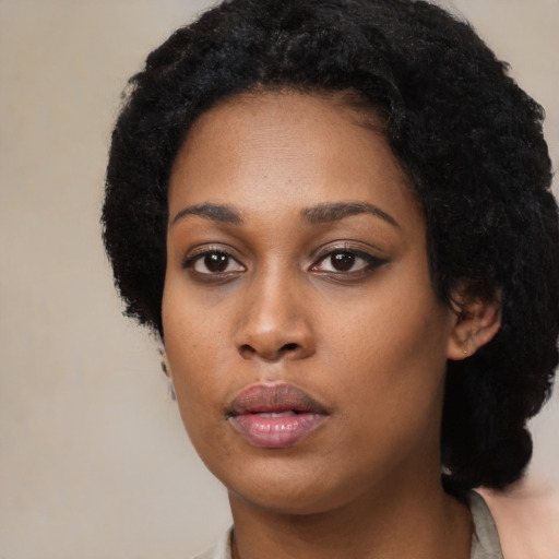 Neutral black young-adult female with short  black hair and brown eyes