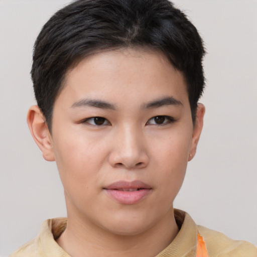 Joyful asian young-adult female with short  brown hair and brown eyes
