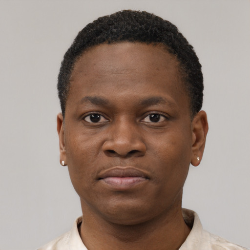 Neutral black young-adult male with short  black hair and brown eyes