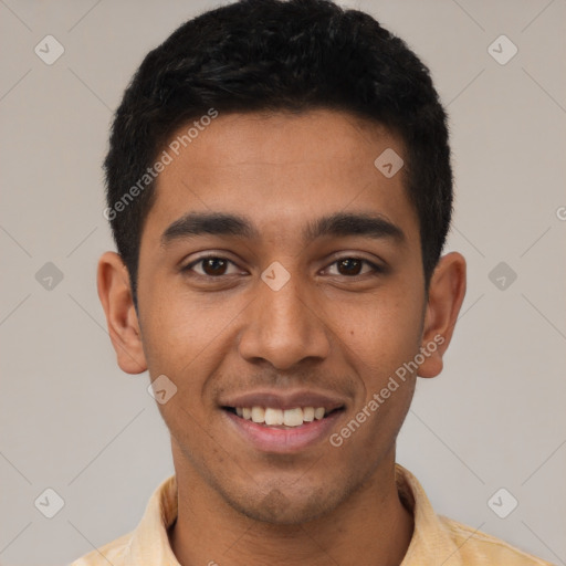 Joyful latino young-adult male with short  black hair and brown eyes