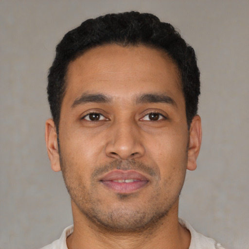 Neutral latino young-adult male with short  brown hair and brown eyes