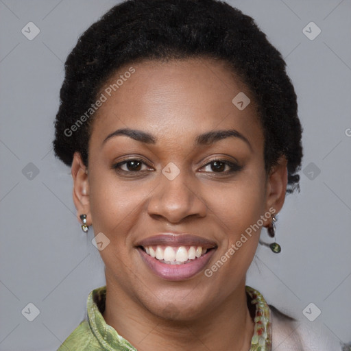 Joyful black young-adult female with short  brown hair and brown eyes