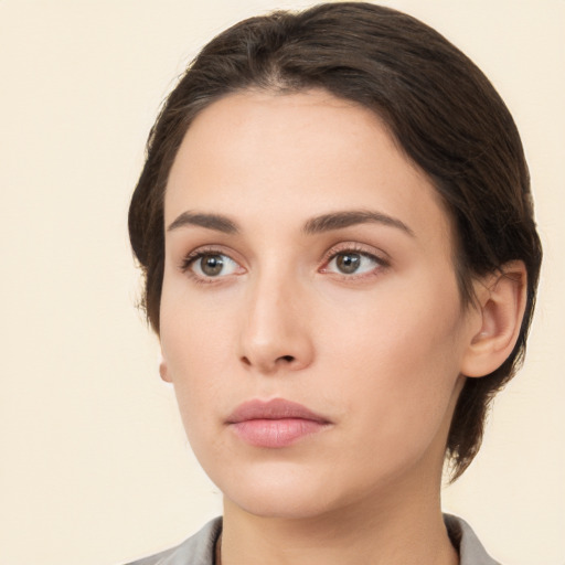 Neutral white young-adult female with medium  brown hair and brown eyes