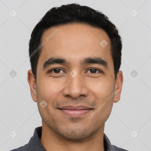 Joyful latino young-adult male with short  black hair and brown eyes