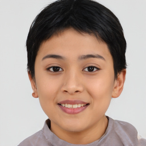 Joyful asian child female with short  brown hair and brown eyes