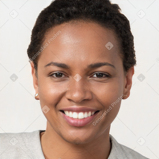 Joyful black young-adult female with short  brown hair and brown eyes