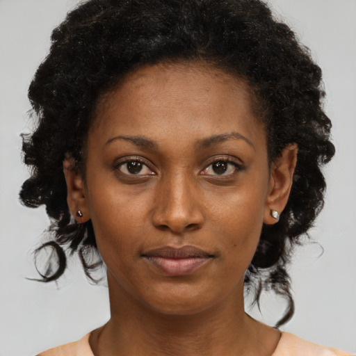 Neutral black young-adult female with medium  brown hair and brown eyes