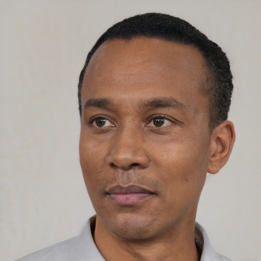 Neutral black adult male with short  black hair and brown eyes