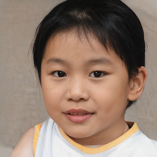 Joyful asian child female with short  brown hair and brown eyes